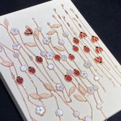 van-cleef-arpels-lucky-spring-long-necklace-15-motifs-rose-gold-carnelian-mother-of-pearl-onyx-vcarp7rt00